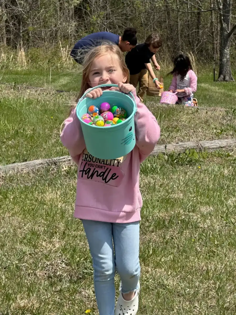 Child with Easter eggs at New Life Assembly